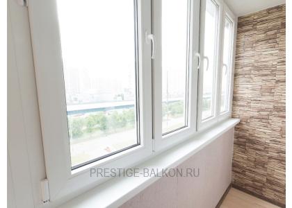 Тёплое остекление балкона профилем КВЕ и комбинированной отделкой пластиком и деревом в Королеве