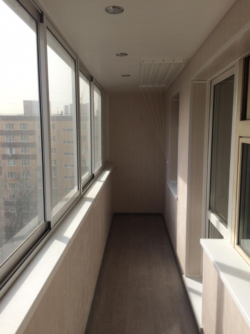 Теплое остекление балкона профилем KBE и установка сушилки в Королеве